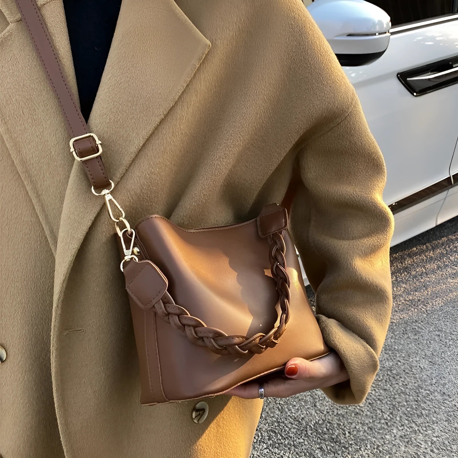 Retro-inspired woven PU crossbody bucket bag in khaki colour showing androgynous design details