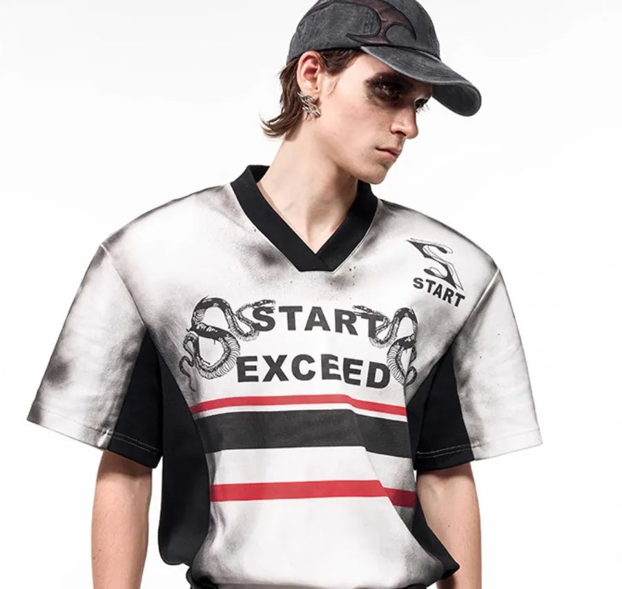 Women's short sleeve V-neck polyester shirt with snake letter print and padded shoulders.