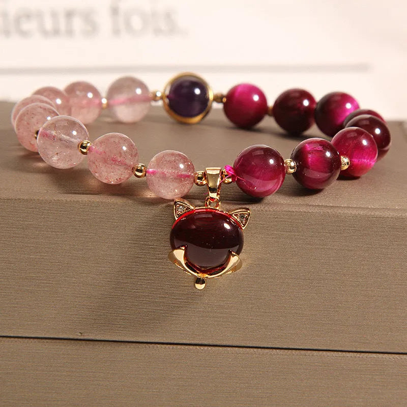 Women's simple strawberry crystal elastic bracelet showing natural stones on stretchable 18cm band
