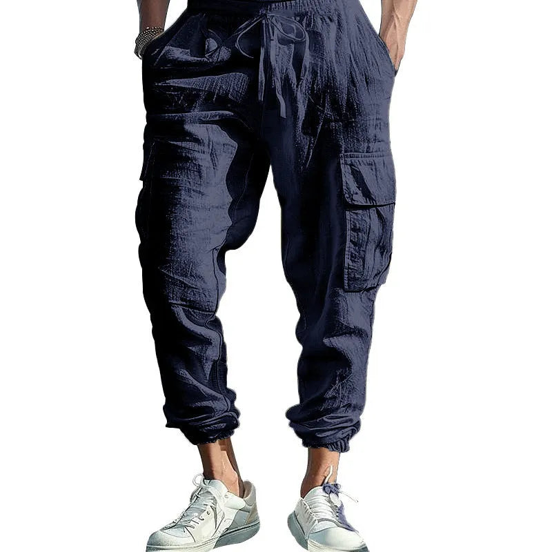 Men's loose linen trousers with ankle tie closure in army green colour.