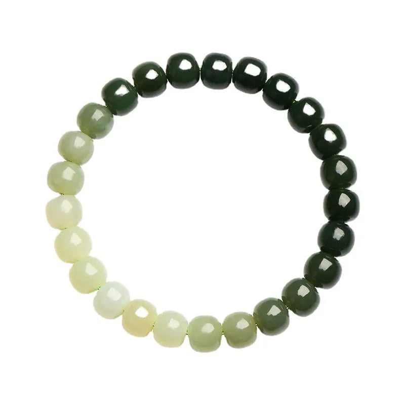 Natural Hetian jade bracelet with water gradient colours on wrist.