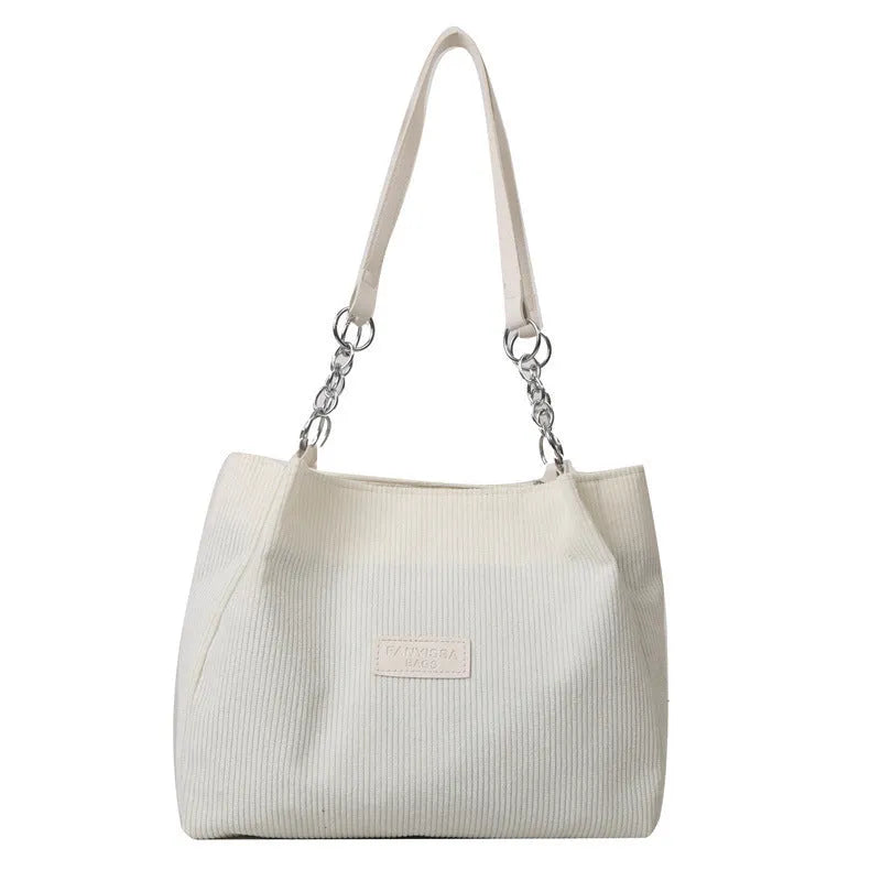 Corduroy one-shoulder tote handbag in horizontal square shape with three-dimensional pockets