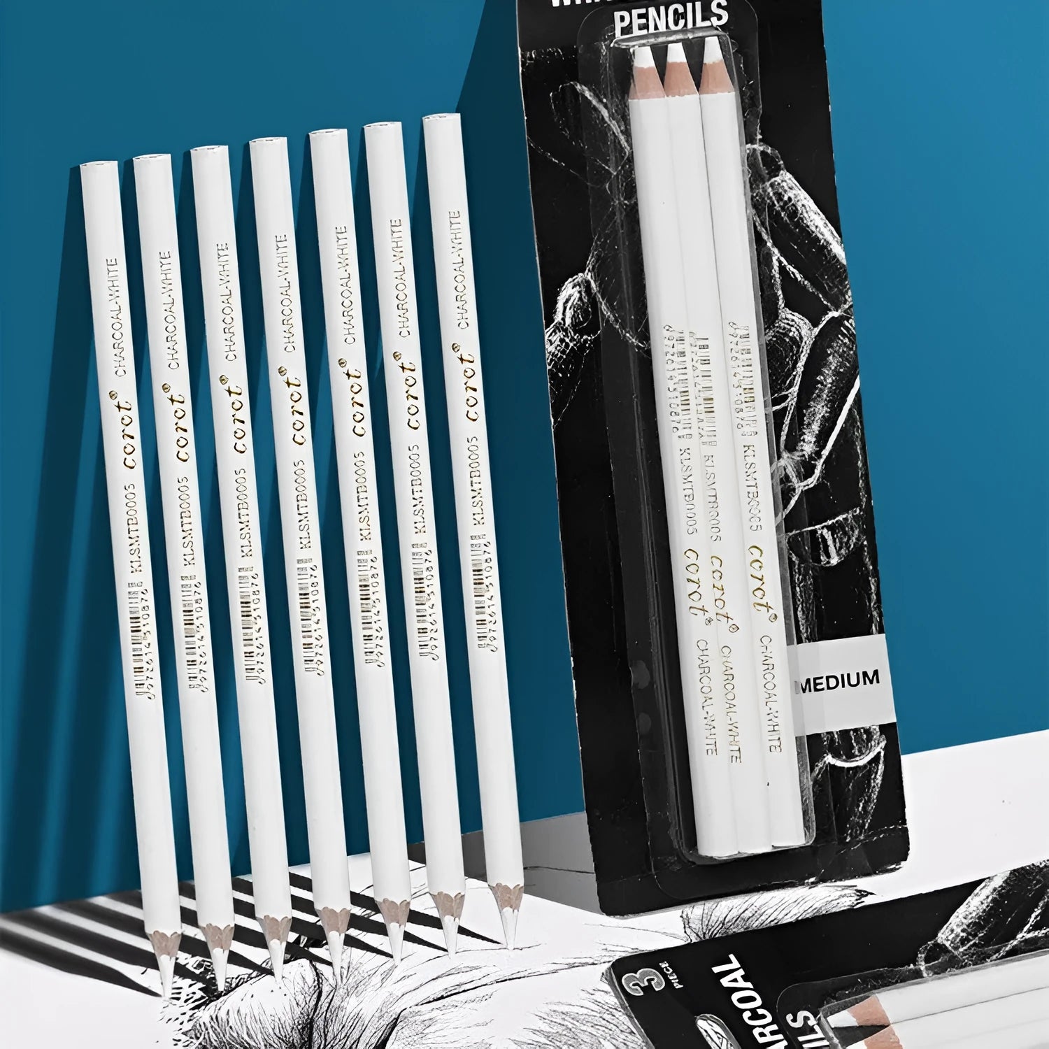 Set of three white charcoal pencils with wooden barrels and moderate hardness