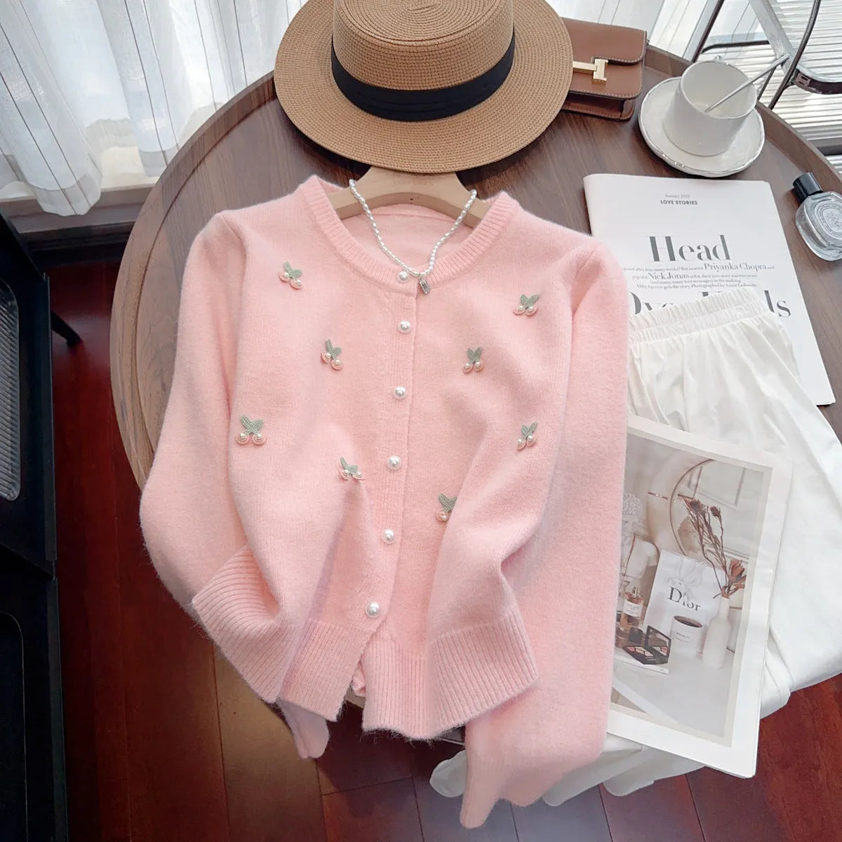 Women's soft pink cashmere blend cardigan coat with round neck, beaded detail, and slim fit.
