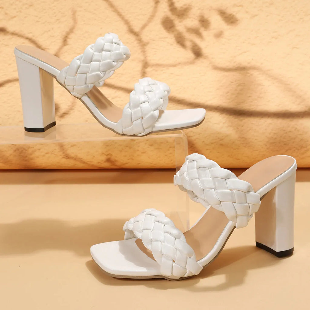 White square toe flip-flops with woven twisted detail and a chunky rubber heel.