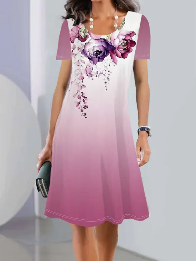 A mid-length floral print dress with short sleeves and a round neckline on a mannequin.