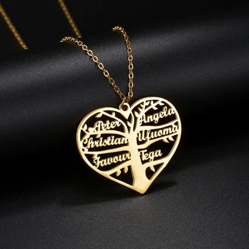 Personalised women's stainless steel necklace with a hollow heart and tree pendant engraved with names, shown on a model.