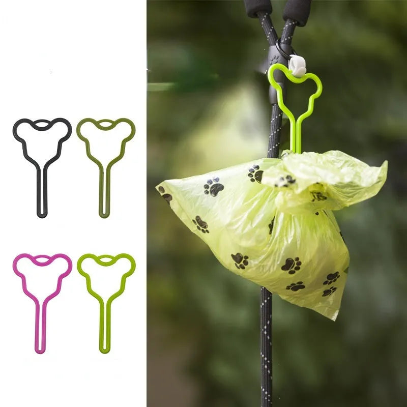 Hands-free dog poo bag holder with fixed clip and adjustable velcro strap.