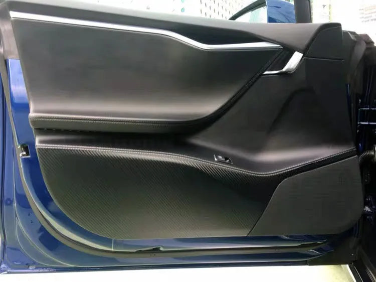 Carbon fibre protective film kit for Tesla Model S doors showing four pre-cut pieces