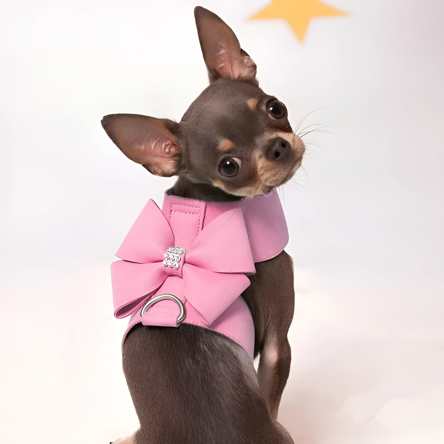 Cute pink microfiber dog chest strap harness with a large bowknot decoration and a metal D-ring.
