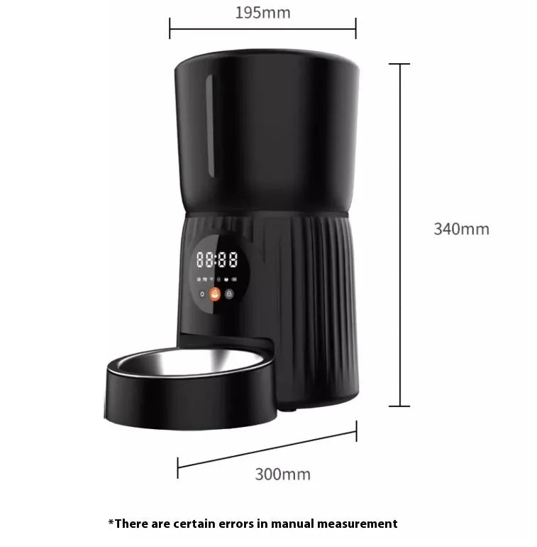 Black automatic pet feeder with digital display and food container on kitchen counter