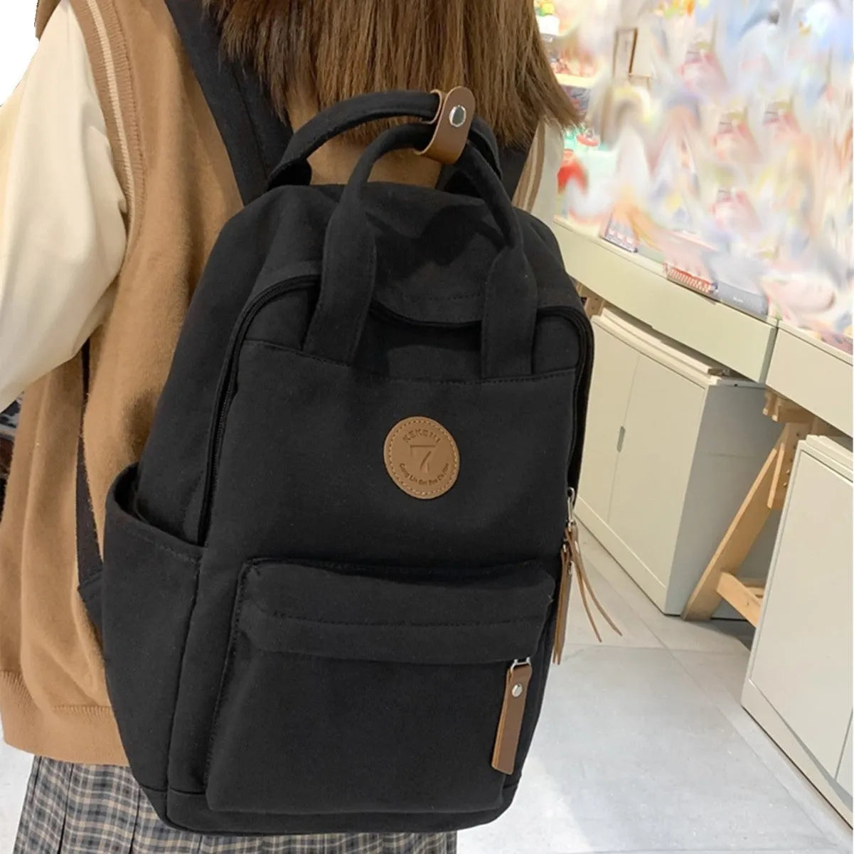 Black Oxford cloth backpack with curved shoulder straps
