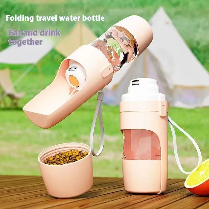 Green portable pet water bottle and food feeder with attached lanyard, showing transparent cup design.