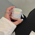 Silicone AirPods case with holographic laser ring design, shown next to AirPods Pro 2 and AirPods 3.