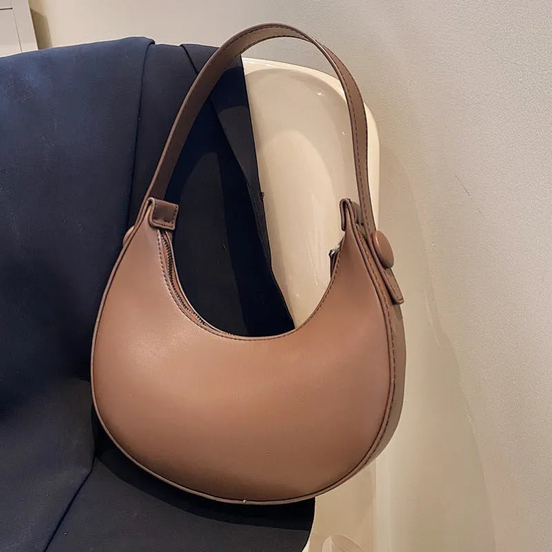 Women's retro dumpling-shaped PU shoulder bag in cream yellow with sandwich pocket