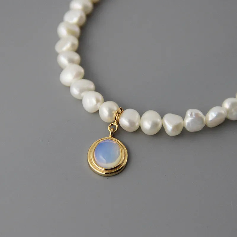 Silver necklace with round medal pendant and irregular pearl charm on adjustable 21-50cm chain