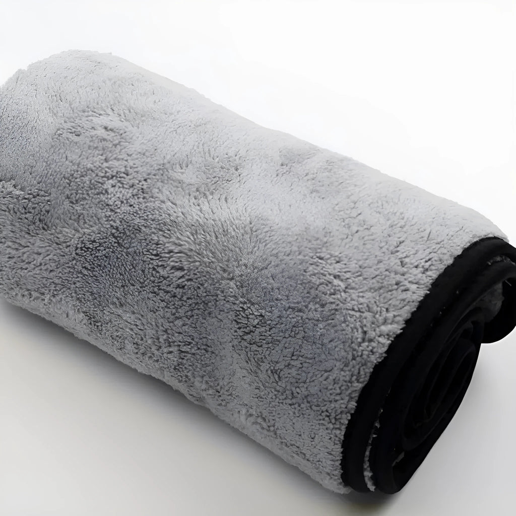 Three size options of a blue microfiber car wash and drying towel laid flat.