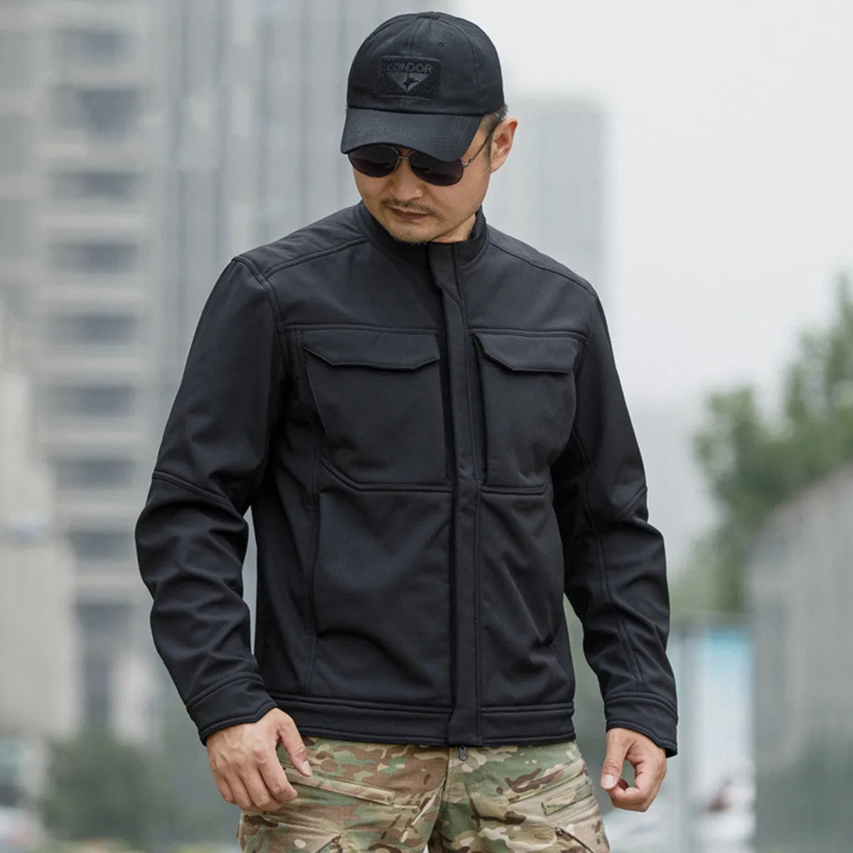 Tactical soft shell jacket in black colour for mountaineering and camping