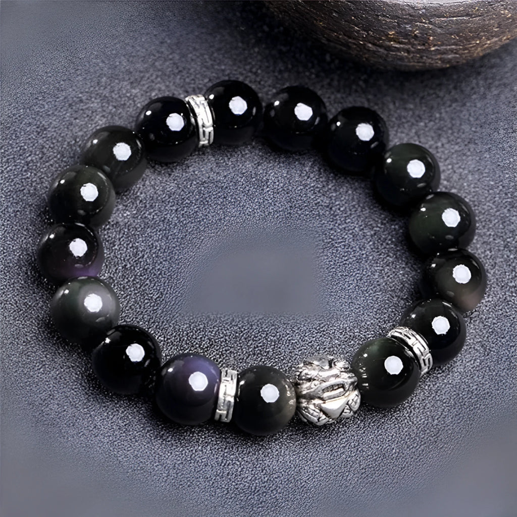 Obsidian and 999 silver bracelet with natural cloud pattern beads, shown in 10mm and 12mm sizes.