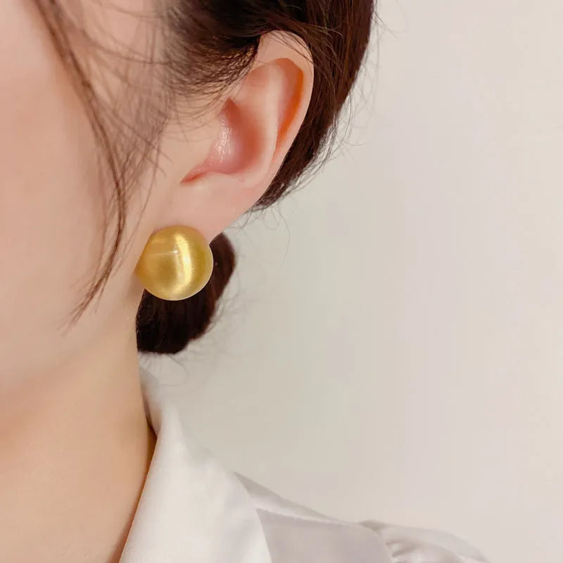 Simple round copper earrings in gold colour with electroplated finish