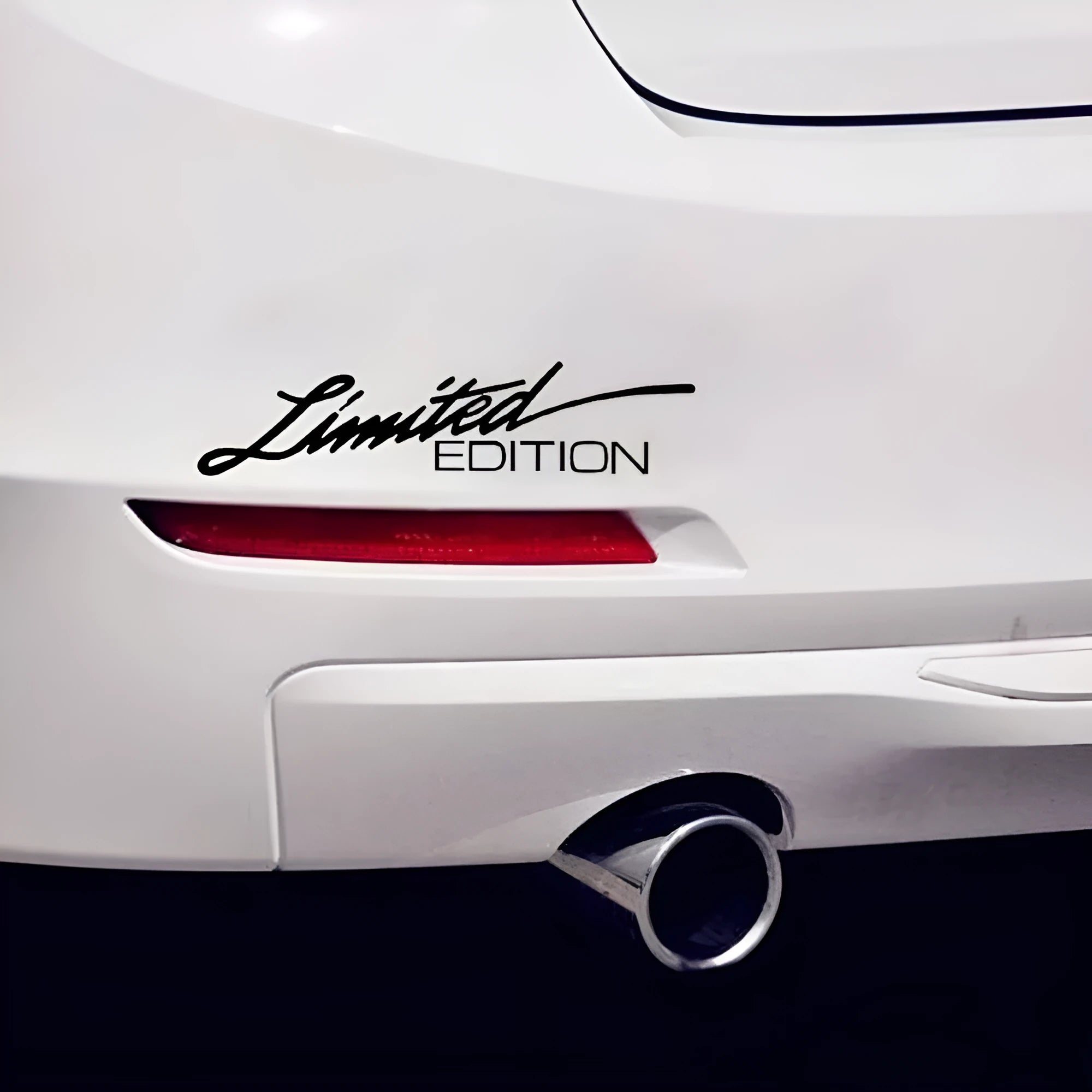 British style reflective plastic bumper sticker, 16cm long, shown in black, white and colourful options.