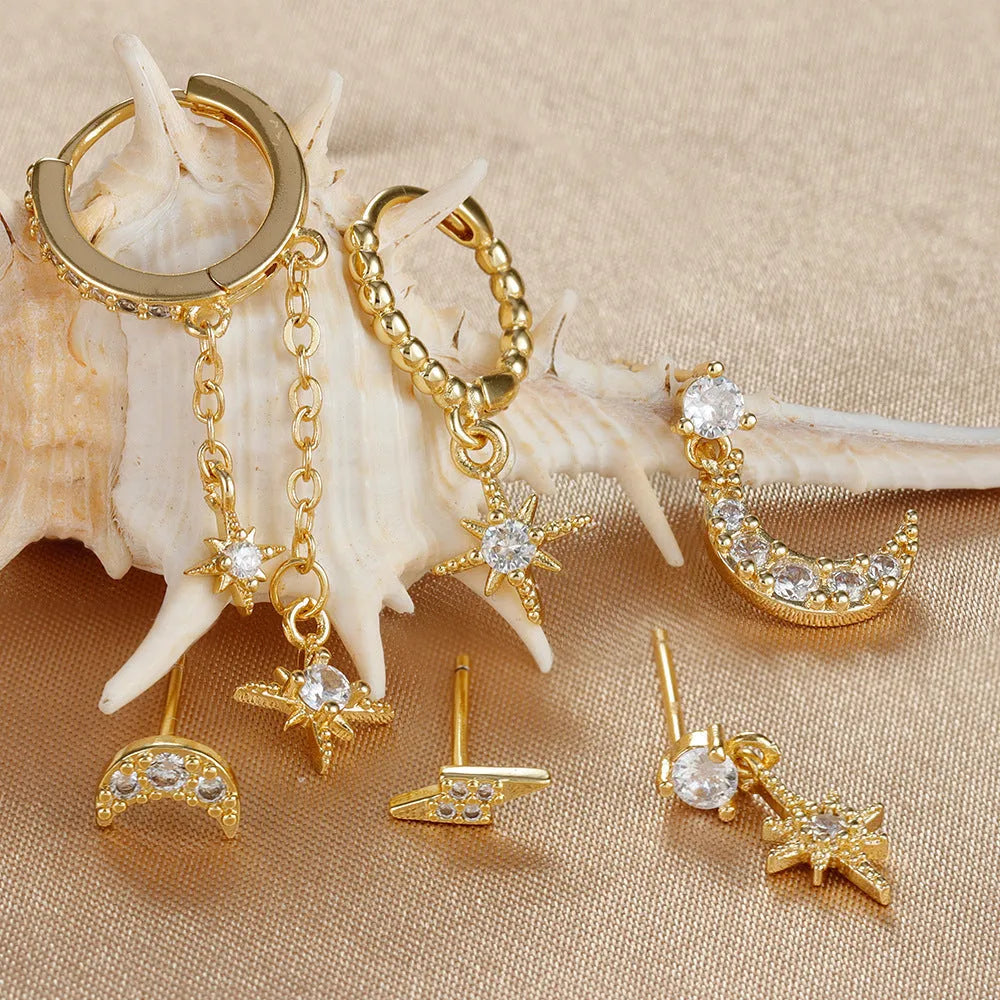 Gold electroplated chain tassel earrings set with six pieces including zircon stud accents