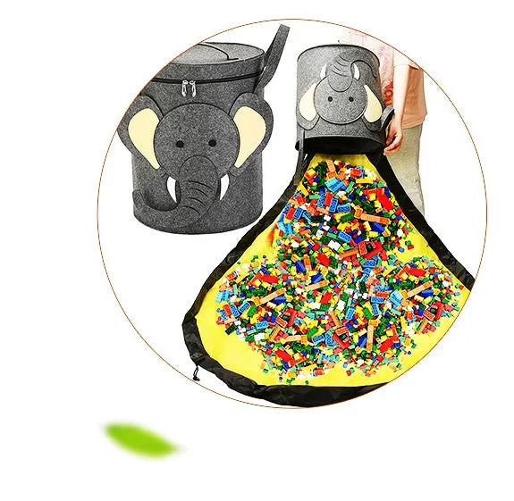 Green felt cube storage bag open as play mat with toys inside and pull rope visible