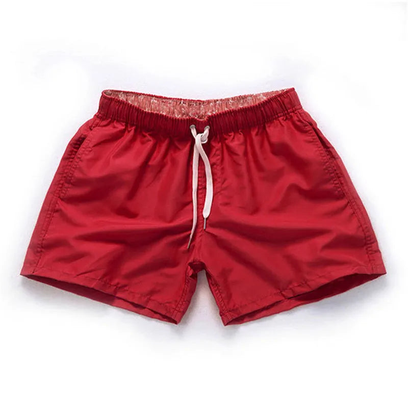 Men's black polyester beach shorts with straight leg opening on a mannequin