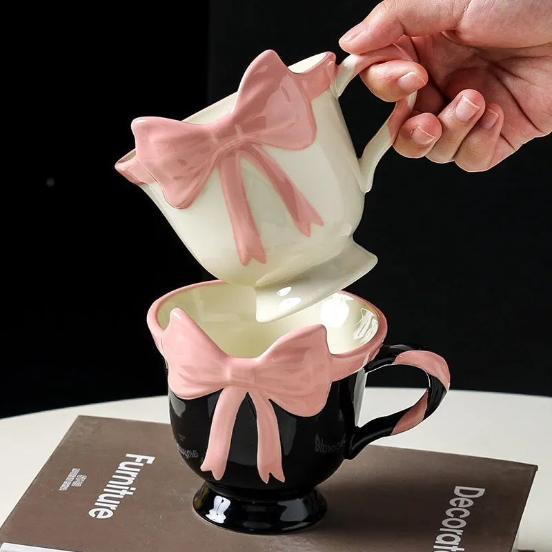 Ceramic mug with heart and bow design in Black Pink colour, showing 301-400ml capacity.