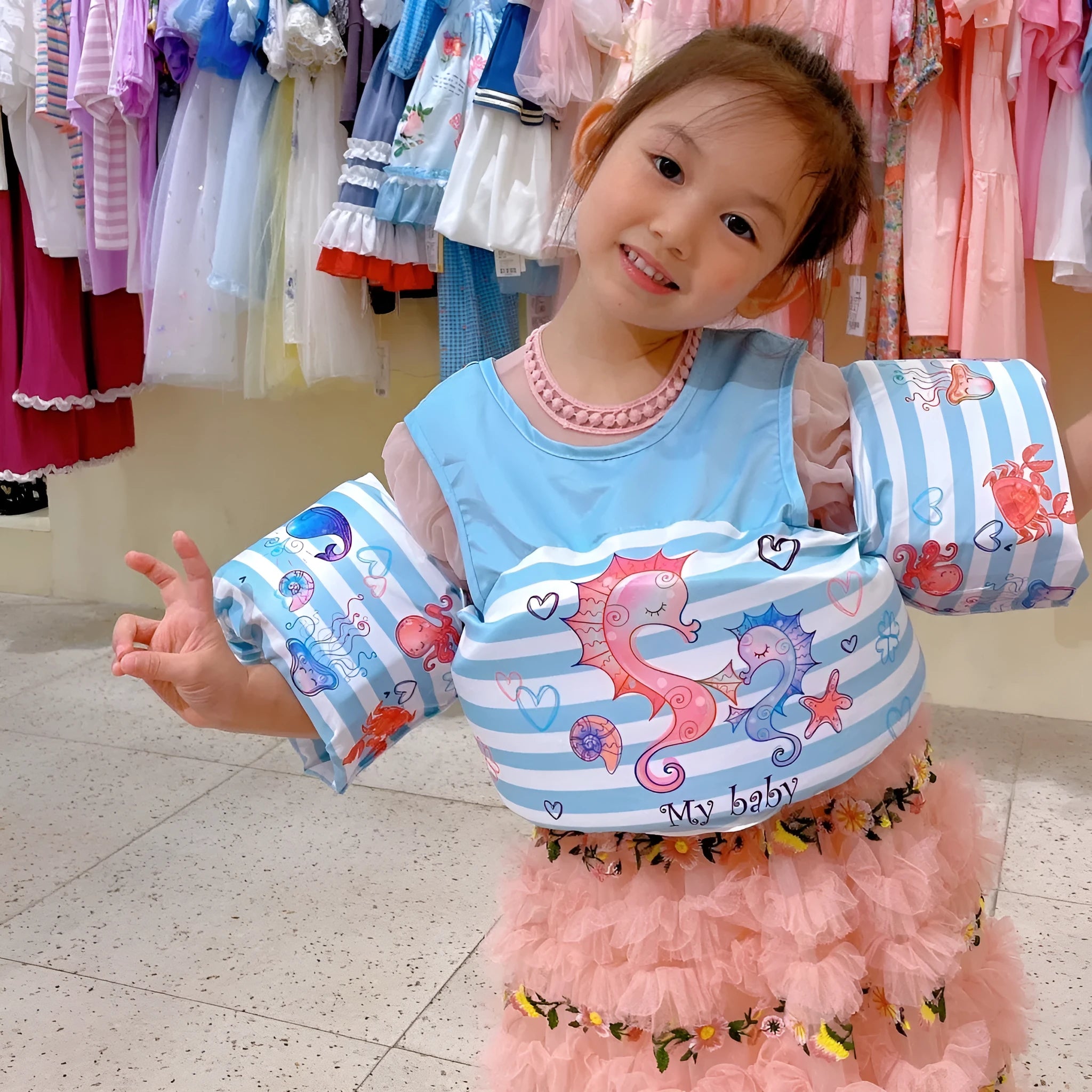 Cartoon-themed children's polyester arm swimming ring life jacket in various print designs.