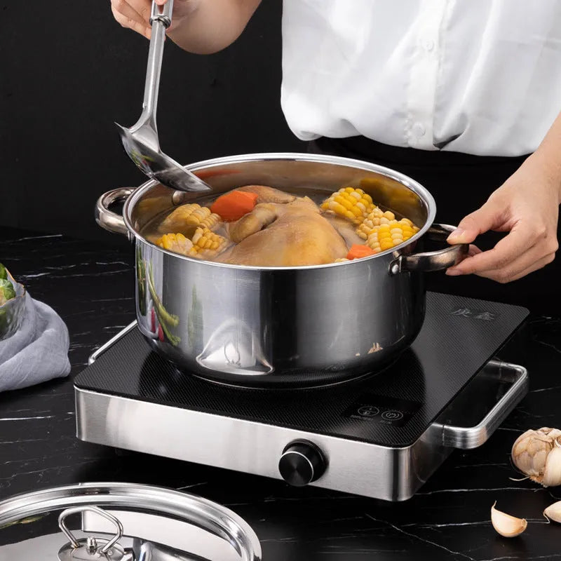 Stainless steel cookware set 15-piece with non-stick pan and glass lids on a countertop
