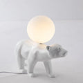 Modern Nordic style white bear table lamp in sitting posture on bedside table