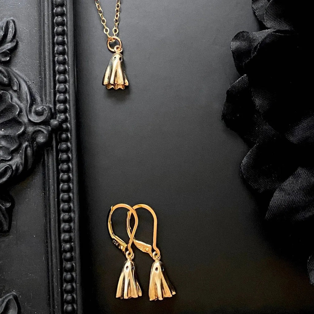 Ghost pendant necklace with twisted stainless steel chain, shown in available chain style options.