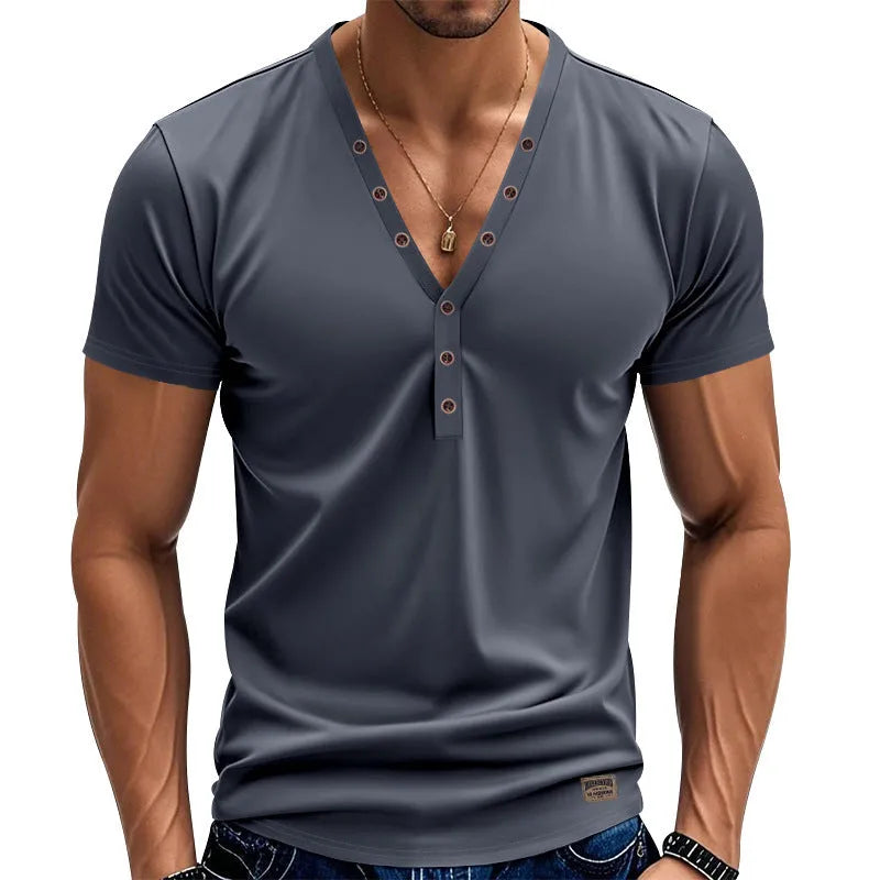 Man wearing a loose-fit grey V-neck button-front casual sports top.