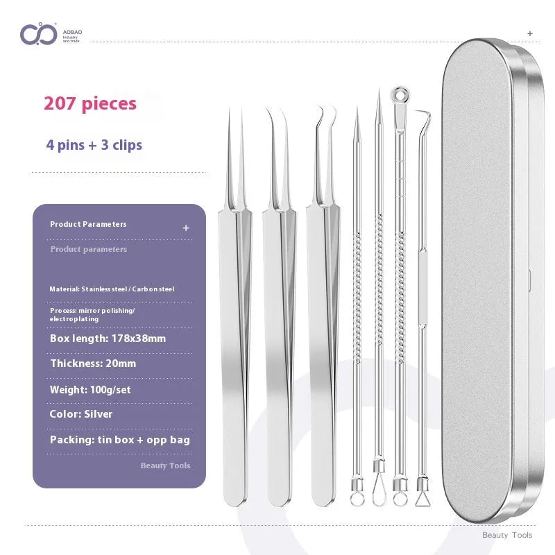 Four silver metal acne needles with pointed tips laid out on a surface.