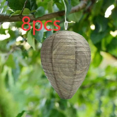 Paper and wire beehive lantern with honeycomb structure, 22 cm wide by 28 cm high.