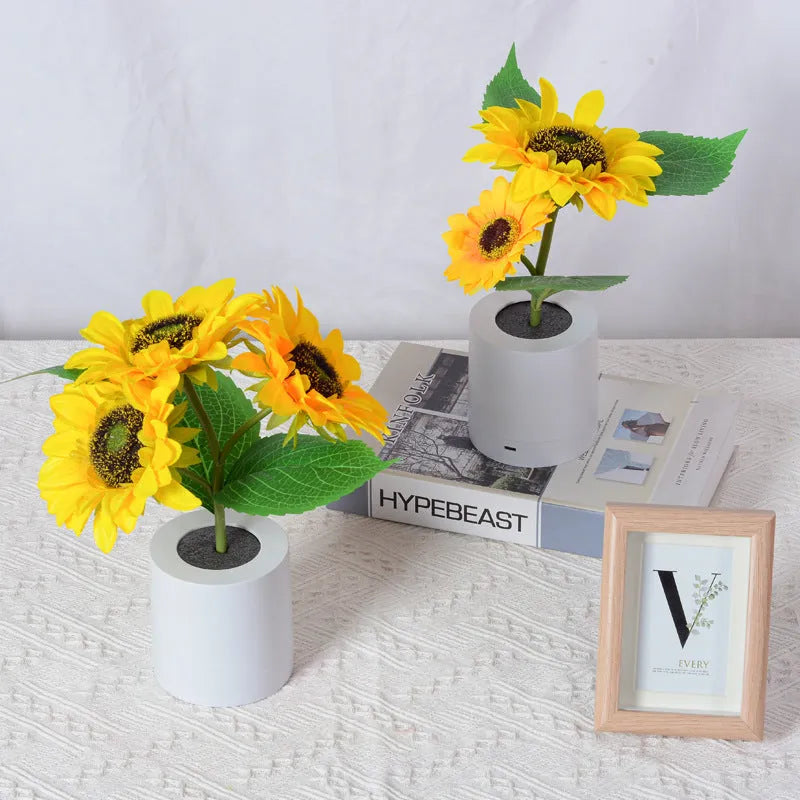 Rechargeable sunflower simulation LED night light table lamp with artificial flowers on a wooden table