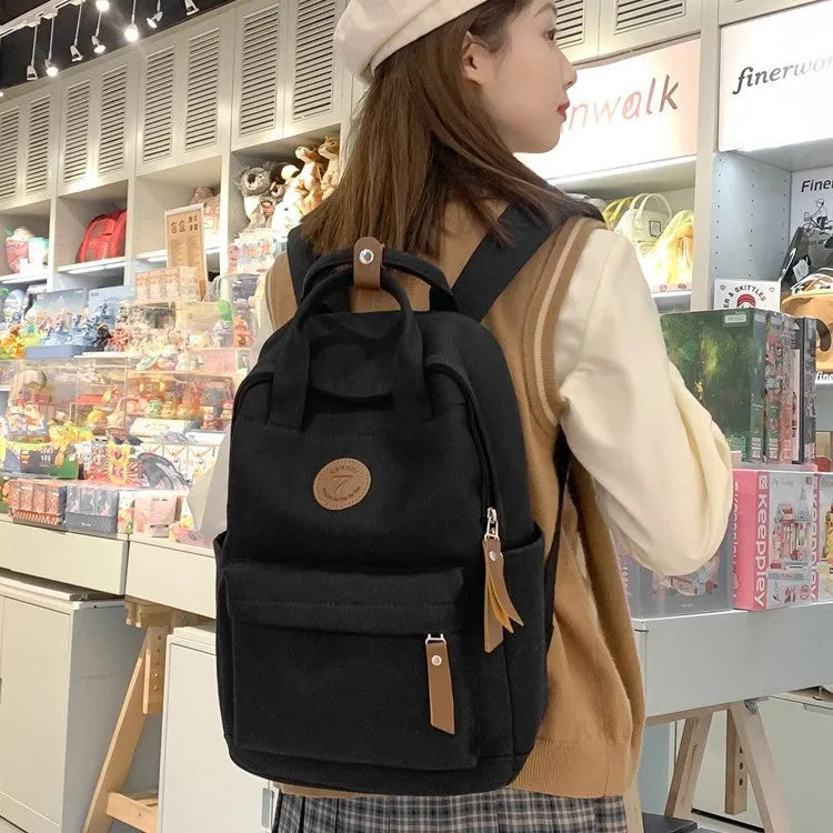 Black Oxford cloth backpack with curved shoulder straps