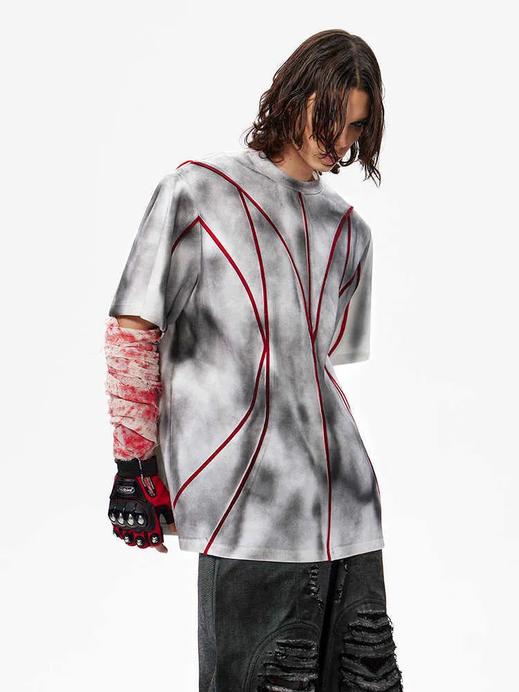 Short sleeve t-shirt with padded shoulders and three-dimensional patchwork design in round neck style