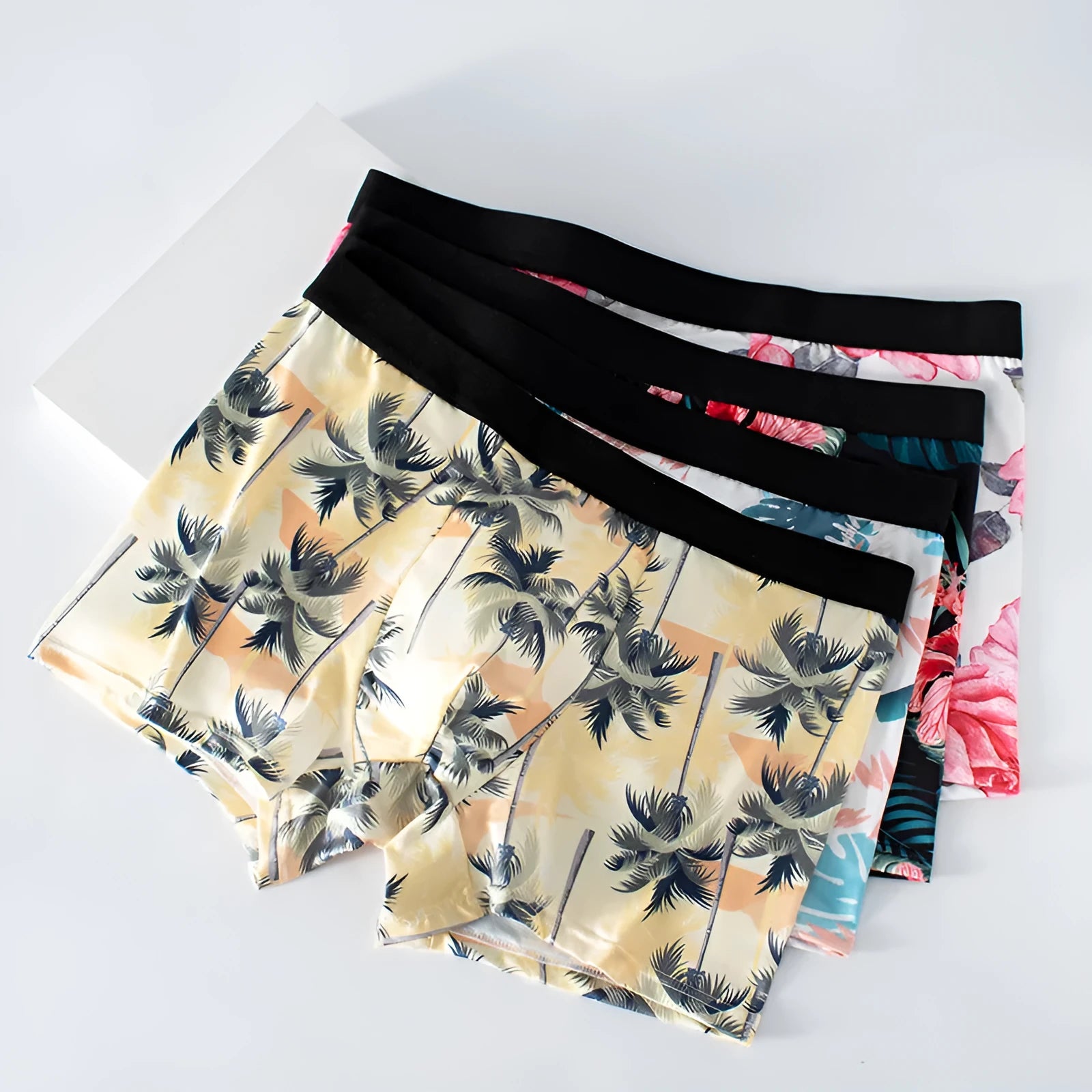 Men's ice silk printed underwear in polyester fabric showing floral design with mid waist cut