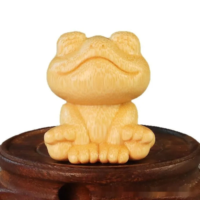 Solid bamboo smiling frog carving ornament measuring 5cm height with 4.5cm diameter