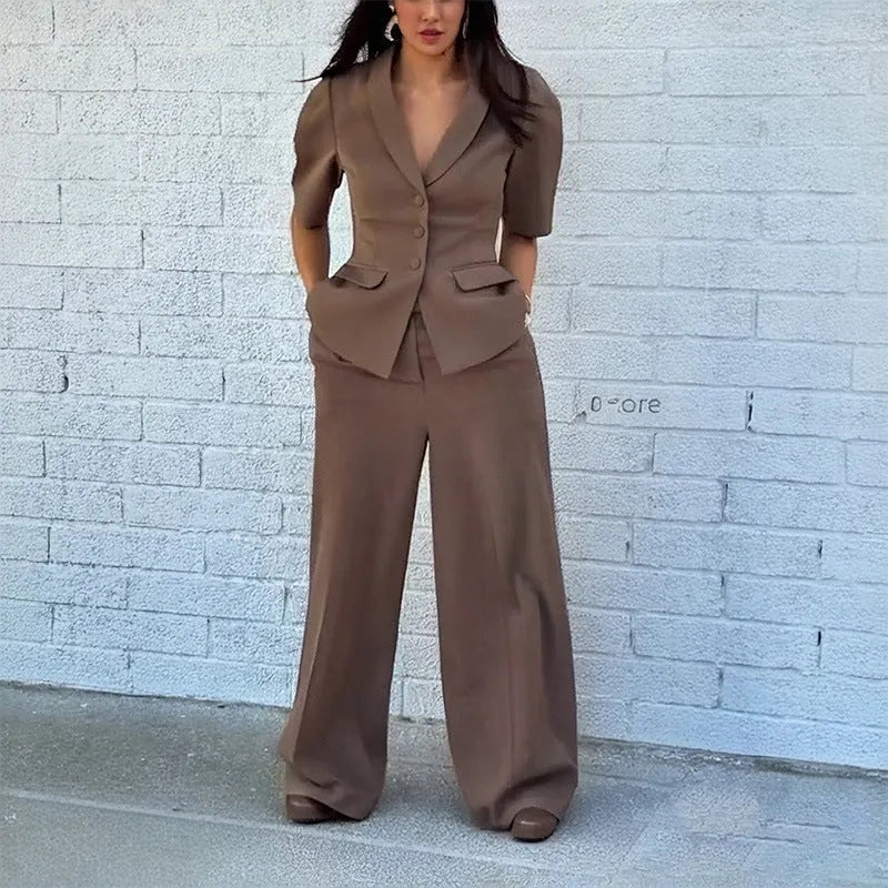 Brown polyester slim fit waist top and trousers suit set with long sleeves on mannequin