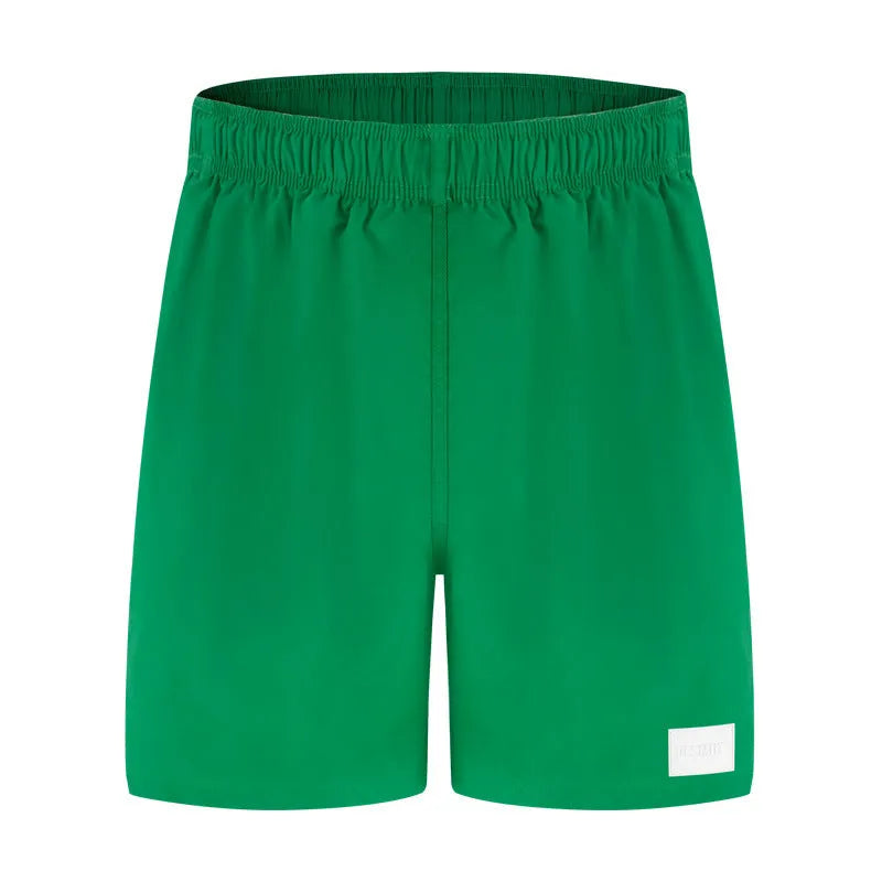 Men's quick-drying nylon sports shorts in solid colours with straight leg opening