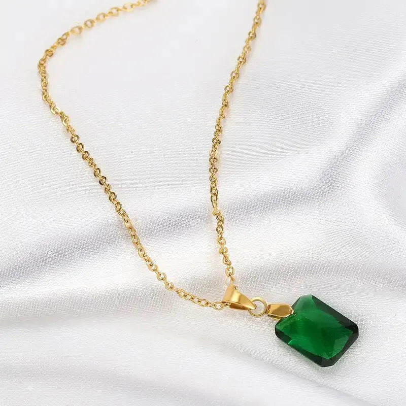Copper necklace with green rectangular geometric quadrilateral pendant on O-ring chain.