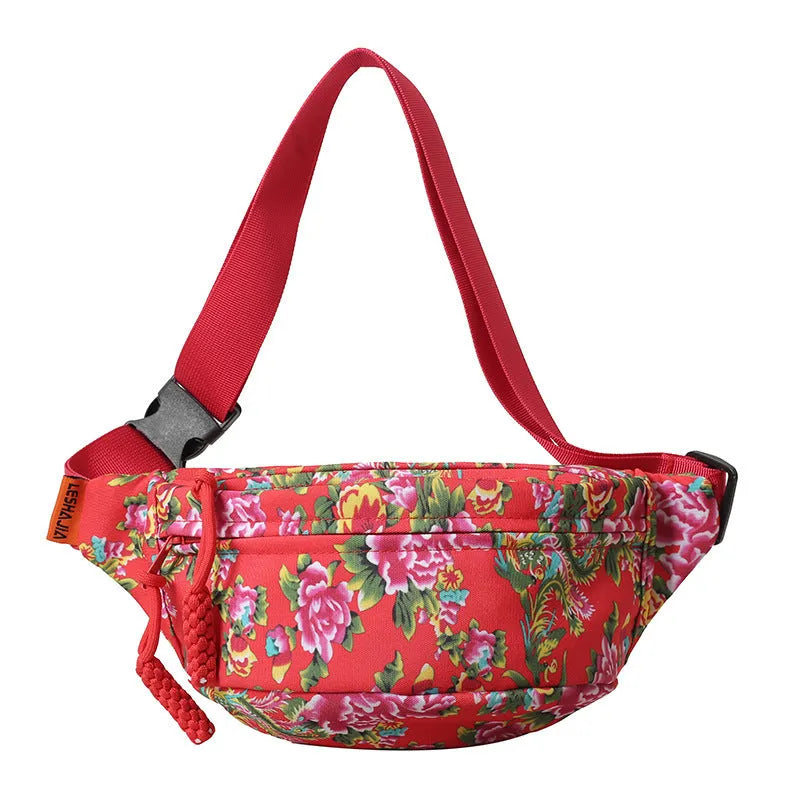 Women's Western-style floral waist bag in nylon with adjustable strap showing contrast stitching