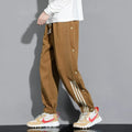 Men's black cotton blend sweatpants with high waist, belt, and adjustable ankle ties