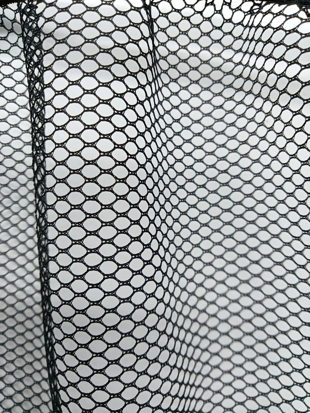 Elastic polyester car boot storage net shown with metal hooks and adhesive strips for organising loose items.