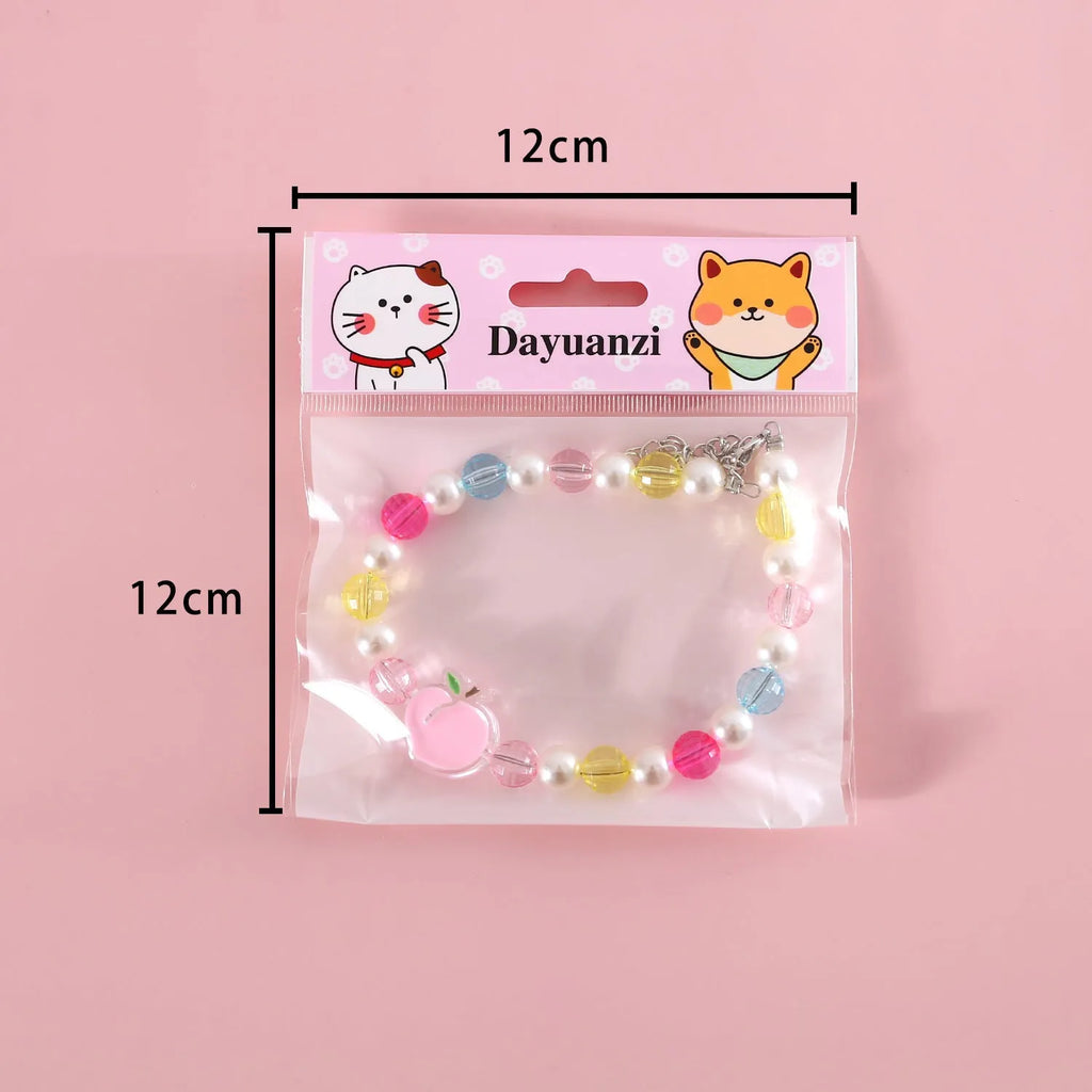 Colourful plastic bead pet necklace for cats with floral and rainbow designs in adjustable XS and S sizing