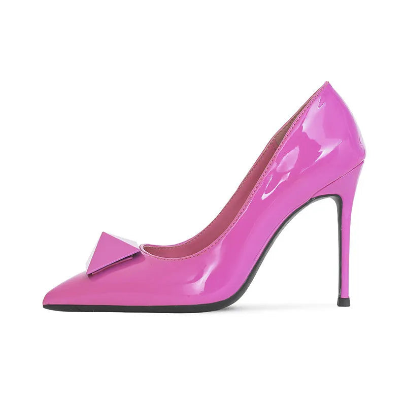 Pink pointed toe stiletto high heels with a buckle detail on the patent leather upper.