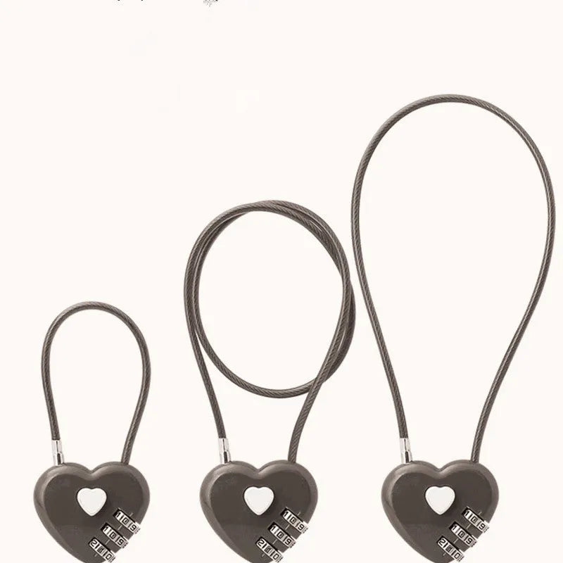 Peach heart-shaped ABS plastic padlock with a steel cable, shown in multiple colour options.